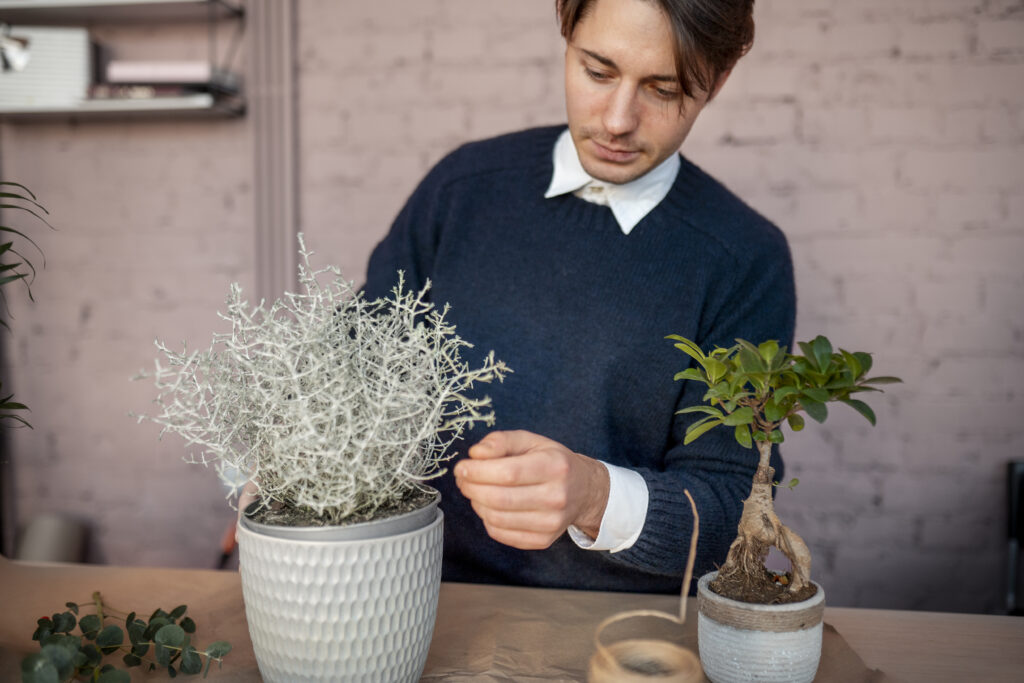 close-up-man-working-flower-shop