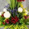 Contains Red Roses, Blue accent flowers, Red cherries & tall spiky grasses