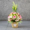 Flower Arrangement Contains Baby Pink roses & lilies with tall spiky grasses