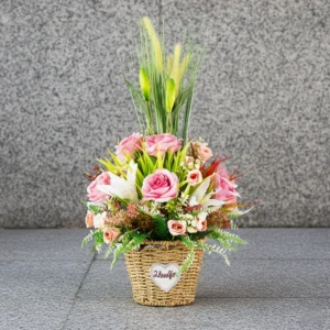 Flower Arrangement Contains Baby Pink roses & lilies with tall spiky grasses