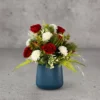 Flower Arrangement Contains Red roses & Daisies with grass & leaves