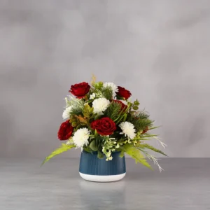 Flower Arrangement Contains Red roses & Daisies with grass & leaves