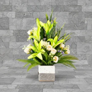 Green lilies, Roses & mini orchids with grasses Flower Arrangement