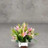 Pink-lilies,-Roses-&-mini-orchids-with-grasses-Flower-Arrangement Flower Arrangement