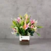 Pink lilies, Roses & mini orchids with grasses Flower Arrangement
