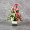 White Tiger lily with renuculus with ferns